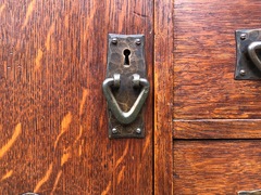 Detail hand hammered copper door handle. 